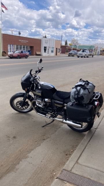 Moto Guzzi parked in front of the River Rock on Main Street, Walden, CO.