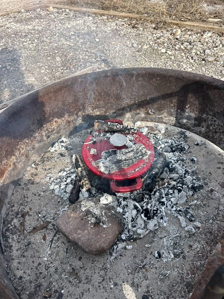 Dutch oven cooking in an iron fire ring