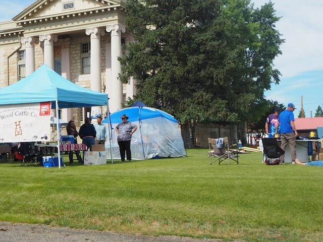 Jackson County Courthouse in Walden, CO with North Park Days vendors and games on the lawn