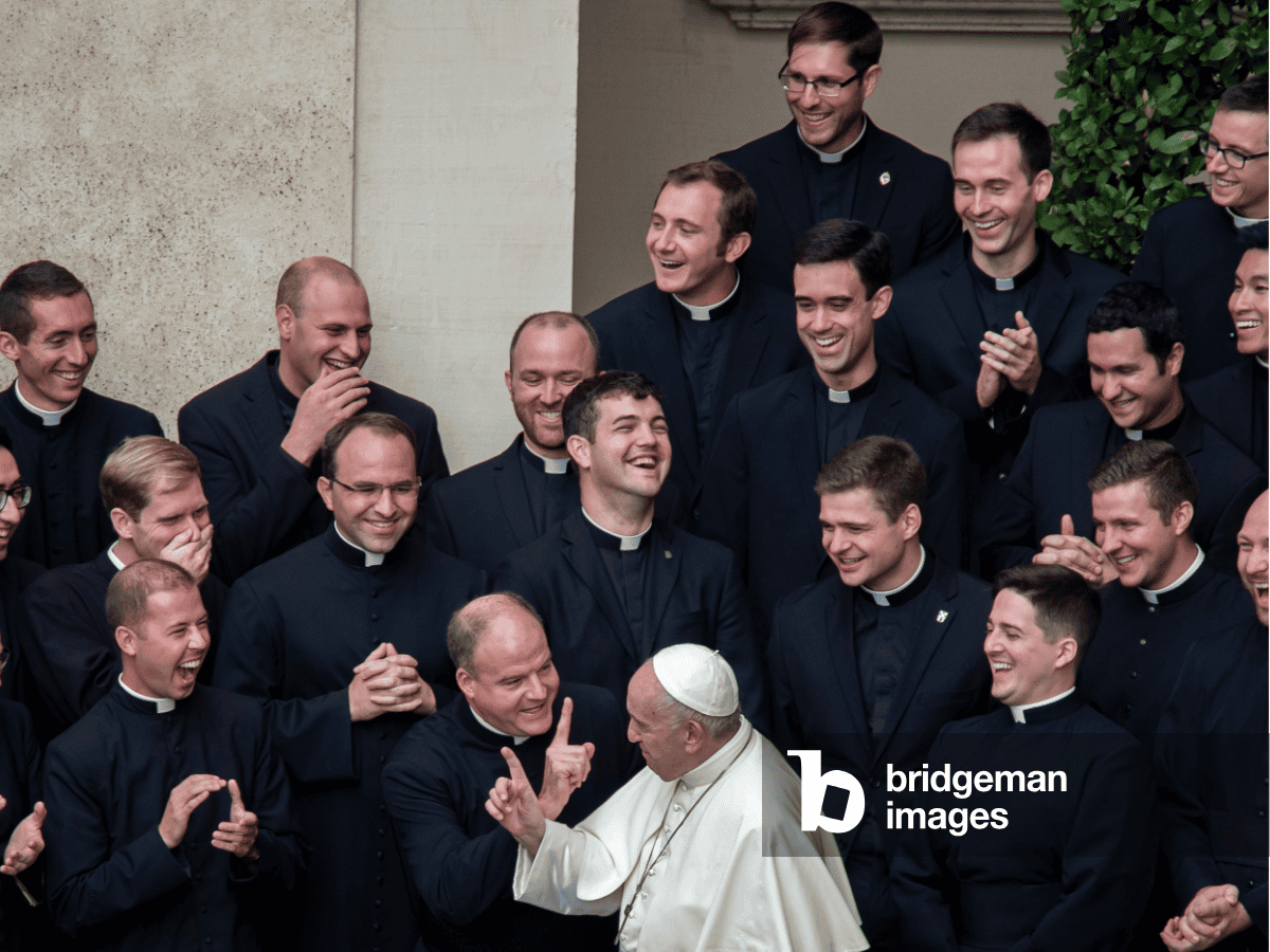 Photograph of Pope Francis with priests at the Vatican