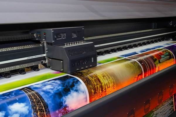A large printer with a large picture
    AI-generated content may be incorrect.