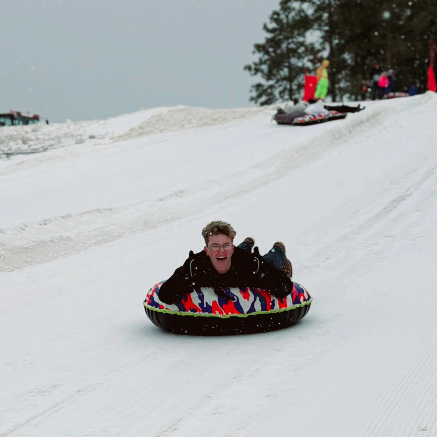 boy snow tubing