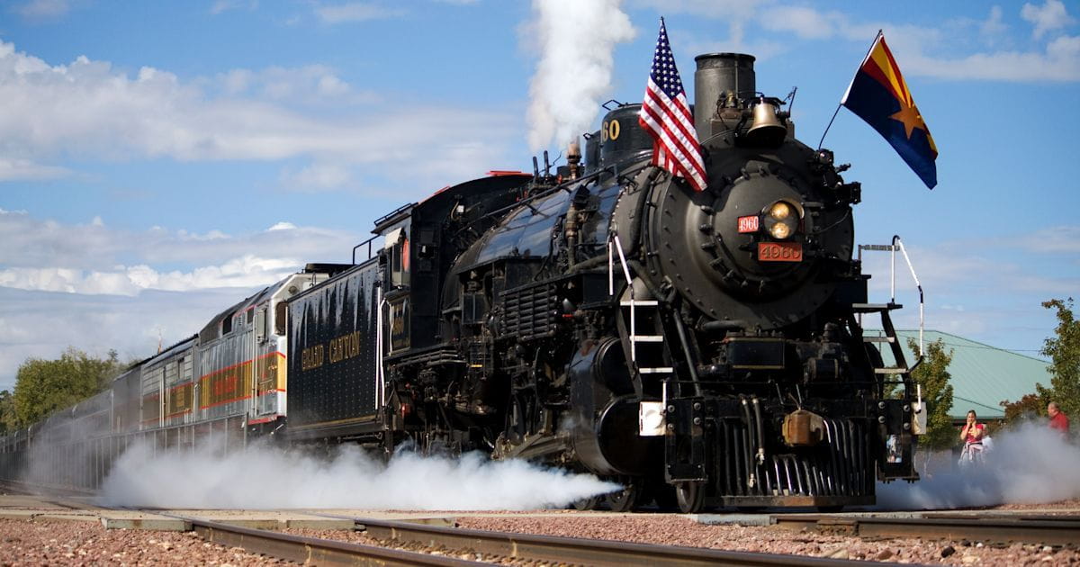 Black steam engine with an Arizona and an American flag.