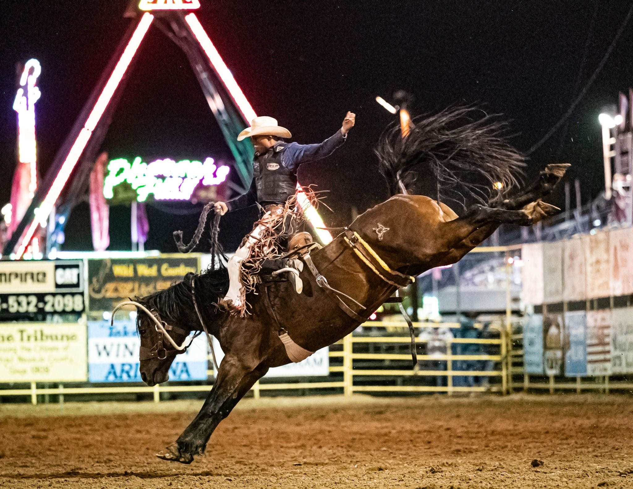Man riding a horse in a rodeo