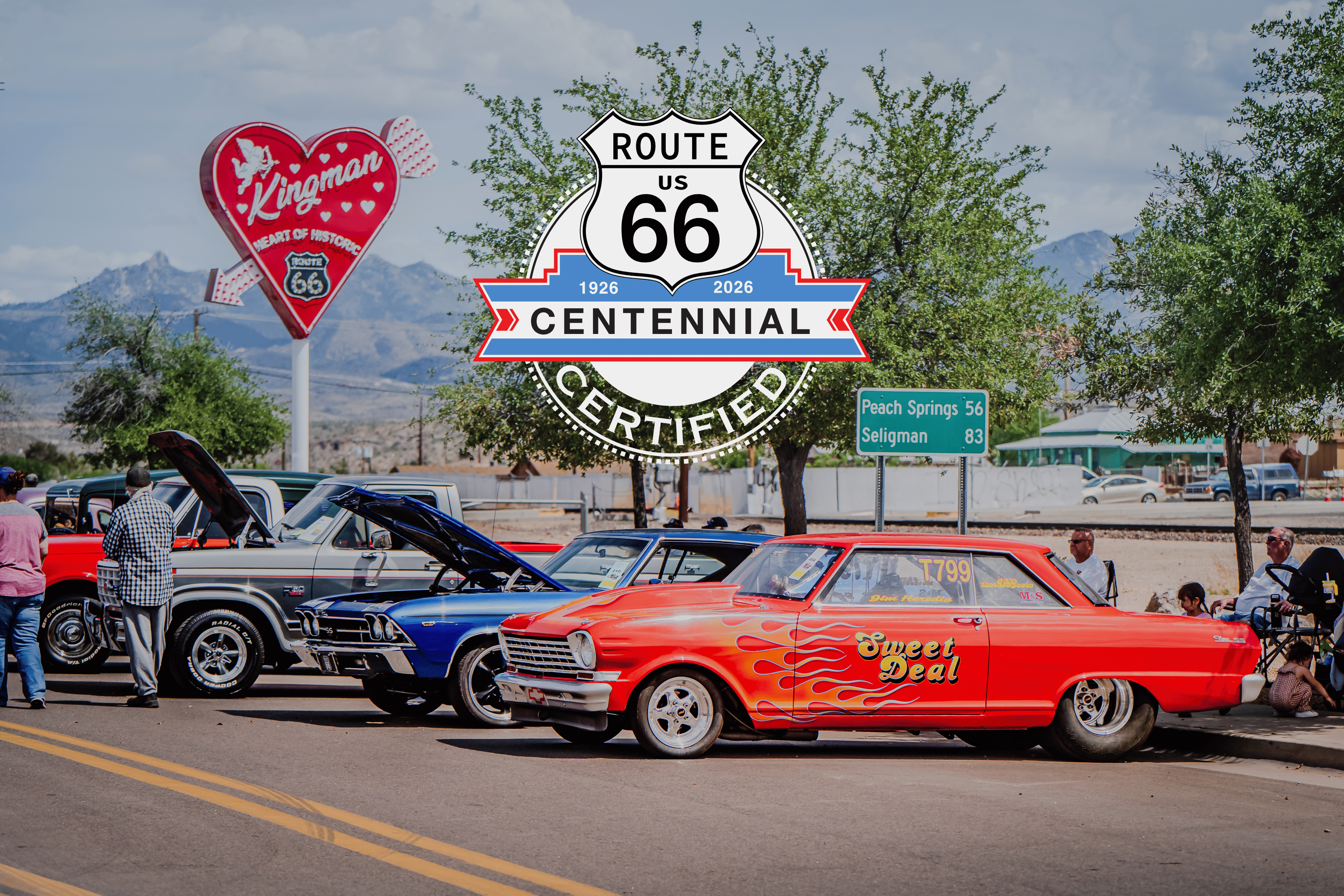 Classic cars line Route 66 in downtown Kingman with a Route 66 Centennial Certified logo on the image
