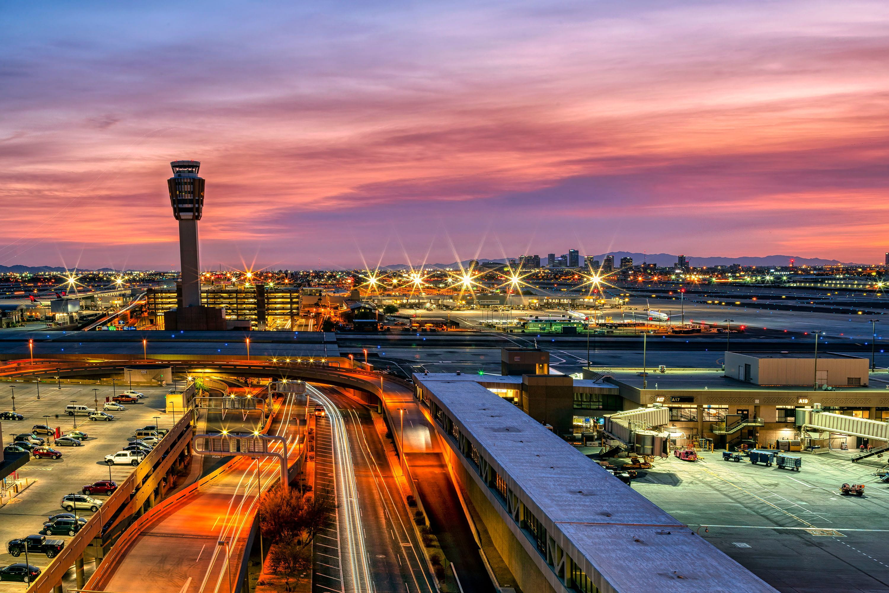 A city scene in front of a sunset. 